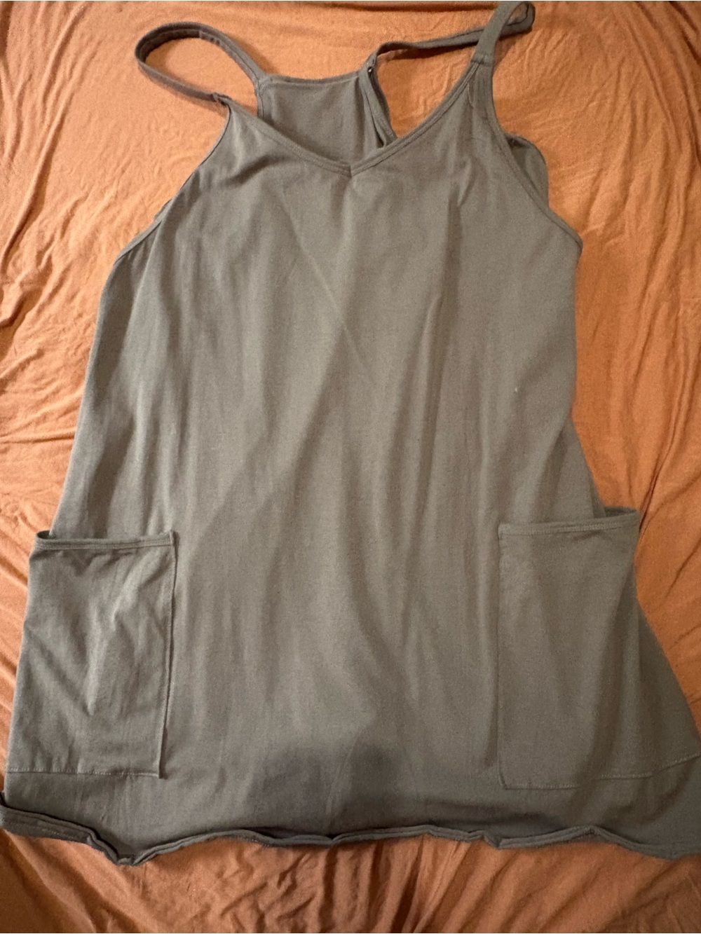 Women’s tan althetic style dress with pockets and spandex underneath